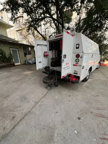 Magnet Plumbing service vehicle on-site for Grease Trap Cleaning in White House